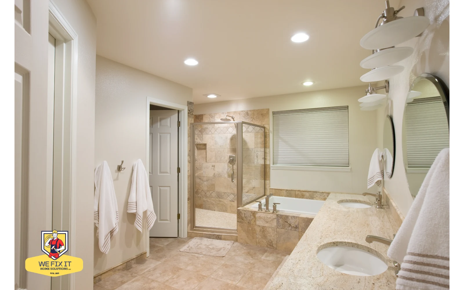 Bathroom with a tiled shower, bathtub and double vanity