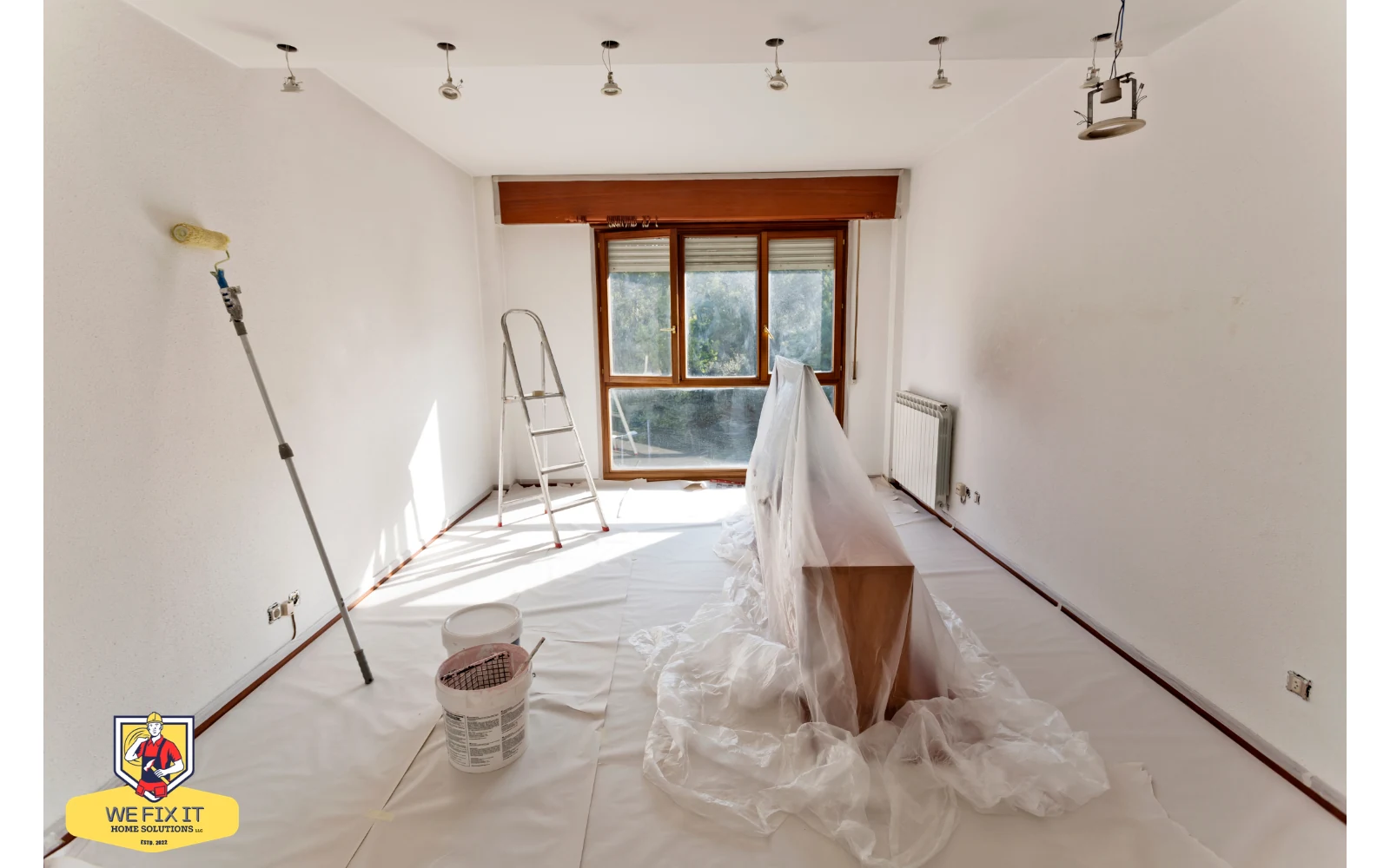 Room prepared for interior painting with floors and furniture protected